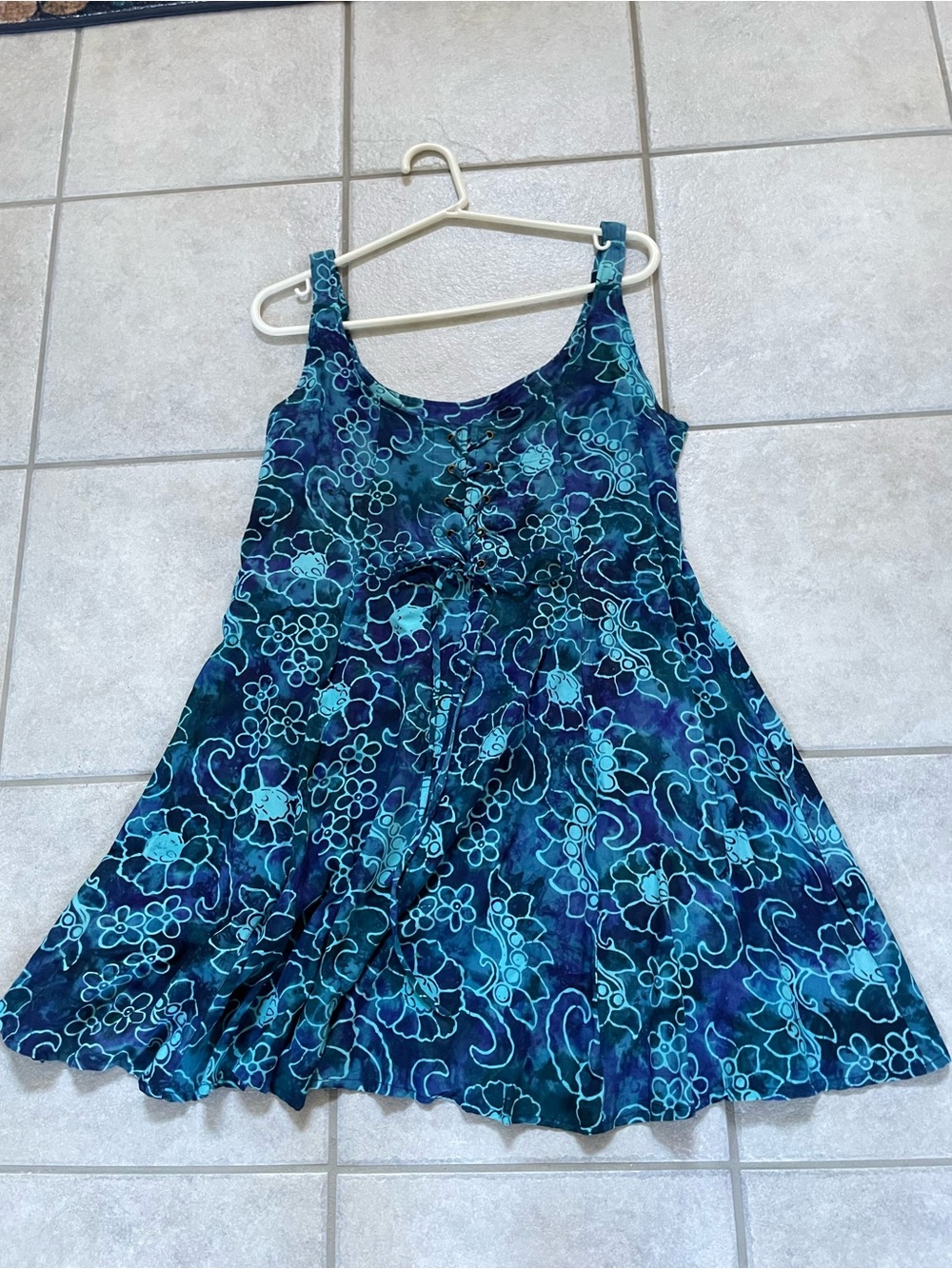 New floral mini dress with lace up front and adjustable straps size M/L